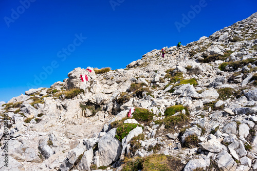 Hiking to Corno Grande summit in a sunny summer day. Gran Sasso National Park, Italy