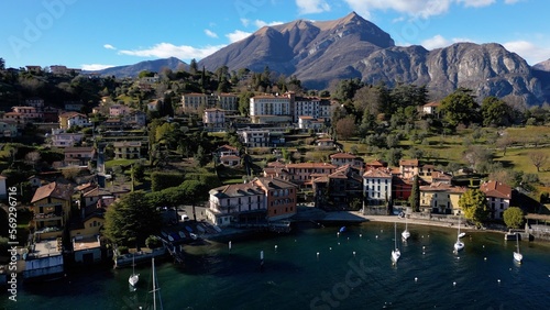 Europe, Lombardy , Drone aerial view of Bellagio, The Pearl of Lake Como, amazing village in north of Italy - port for boats and beautiful nature with mountain near Milan - Tourist attraction 