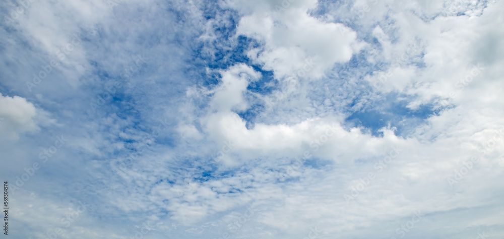Blue sky and cumulus clouds. Wide photo. Blue sky and cumulus clouds. Wide photo.