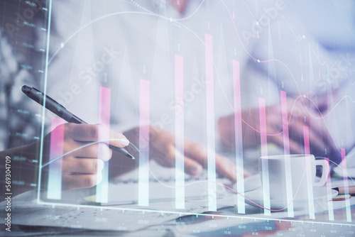 Double exposure of forex graph drawing over people taking notes background. Concept of financial analysis © peshkova