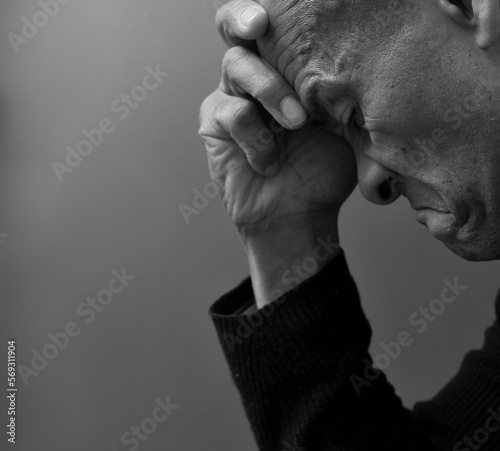 praying to God with hands together on grey black background with people stock photo  © herlanzer
