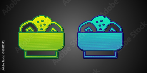 Green and blue Chow mein on plate icon isolated on black background. Asian food. Vector
