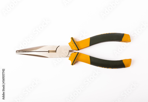 Long nose pliers black yellow color isolated on white background. photo
