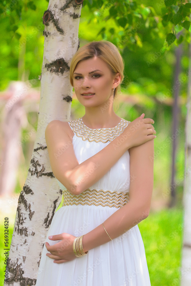 blonde beautiful natural girl with blonde hair in a white dress in nature, on the street, in the garden by a tree, with makeup and hairstyle, greek woman in a white ethnic historical dress, retro blonde beautiful natural girl with blonde hair in a white dress in nature, on the street, in the garden by a tree, with makeup and hairstyle, greek woman in a white ethnic historical dress, retro