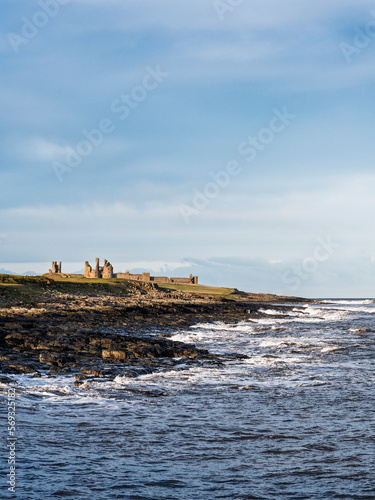 Dunstanburgh Castle on the Northumberland coast with copy space