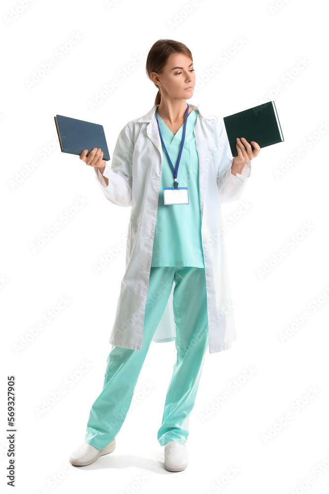 Female doctor with books on white background Female doctor with books on white background