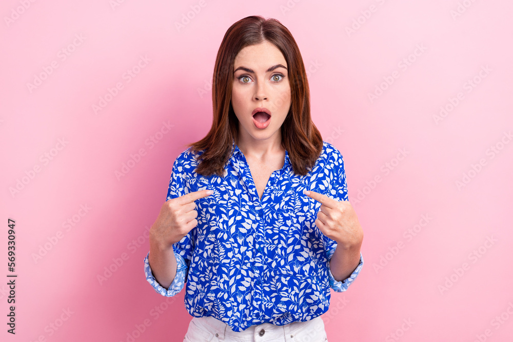 Obraz premium Photo of young confused surprised businesswoman open mouth direct fingers herself blame troubles isolated on pastel pink color background
