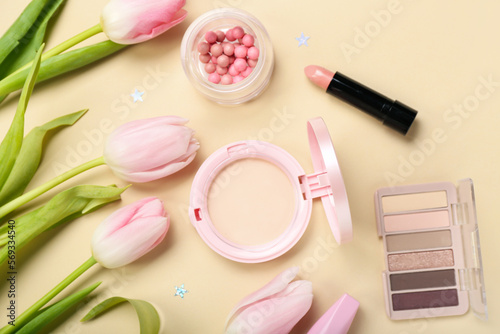 Composition with beautiful tulip flowers and decorative cosmetics on color background, closeup