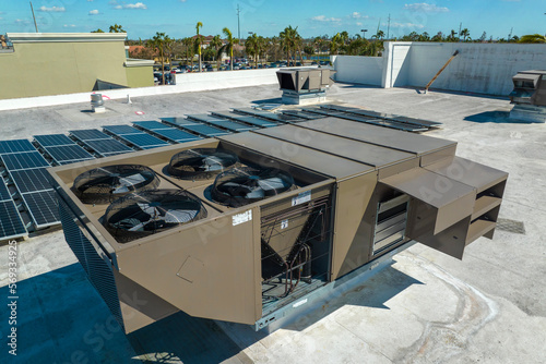 Fotografie External unit of commercial air conditioning and ventilation system installed on industrial building roof
