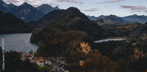 German castle with lake and mountains