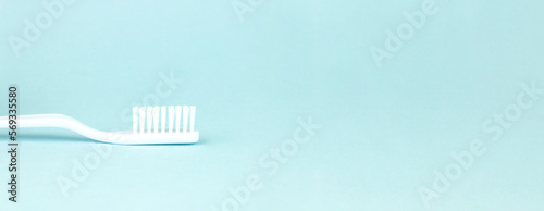 Toothbrush on blurred blue background. Oral Care Concept. Concept of oral hygiene in the family.