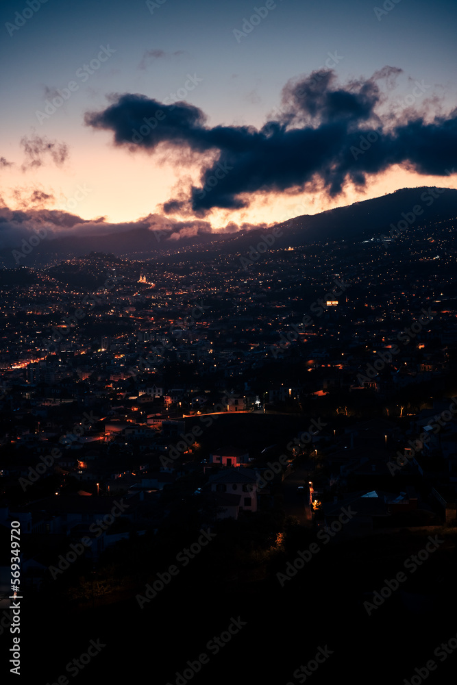 drone view of funchal night city, lights and darkness