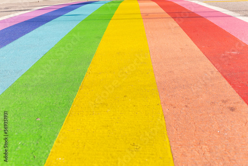 rainbow colors on a street as a symbol for community, diversity, pride and self-assertion, for the freedom of all sexual orientations and forms of gender identity © bmf-foto.de