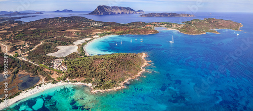 Fototapeta Naklejka Na Ścianę i Meble -  Sardegnia island nature scenery and best beaches. Aerial drone panoramic view of  beautiful Brandinchi beach over sunset. Italy summer holidays