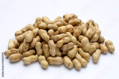 Raw peanuts on white background.