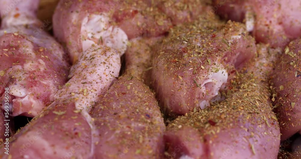 Freshly washed and skinned chicken meat, chicken legs sprinkle with salt and spices ready for cooking Freshly washed and skinned chicken meat, chicken legs sprinkle with salt and spices ready for cooking