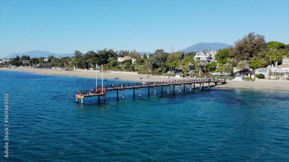 Scenic aerial views of Marbella Club pier, golden mile coastline and La Concha mountain