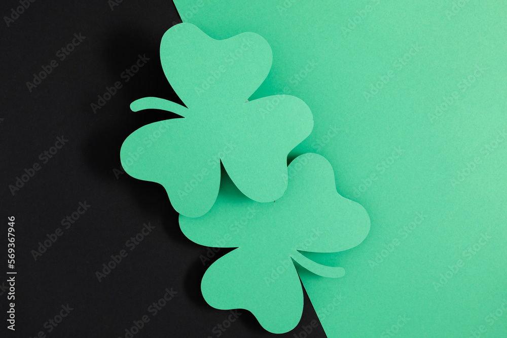 Patrick's Day composition. Holiday decoration for St. Patricks day, clover leaf on black and green background. Flat lay, top view, copy space Patrick's Day composition. Holiday decoration for St. Patricks day, clover leaf on black and green background. Flat lay, top view, copy space