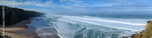 Magoito Beach during storm and high waves, beautiful sandy beach on Sintra coast, Lisbon district, Portugal, part of Sintra-Cascais Natural Park with natural points of interest