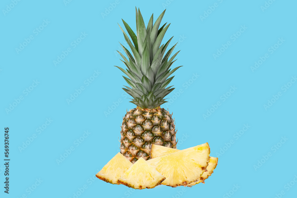 Whole juicy fresh pineapple. Pieces of pineapple half, quarter. On a blue background. Whole juicy fresh pineapple. Pieces of pineapple half, quarter. On a blue background.