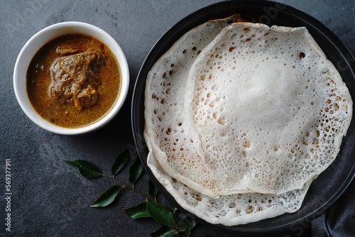 Kerala breakfast appam or palappam with mutton curry photo