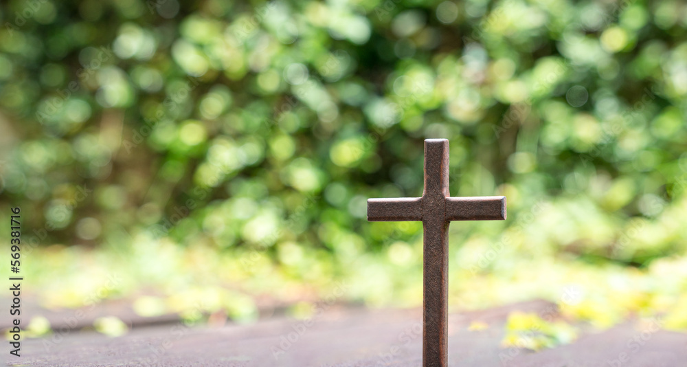 Cross crucifix with green bokeh nature background. Good Friday or christianity concept. Cross crucifix with green bokeh nature background. Good Friday or christianity concept.