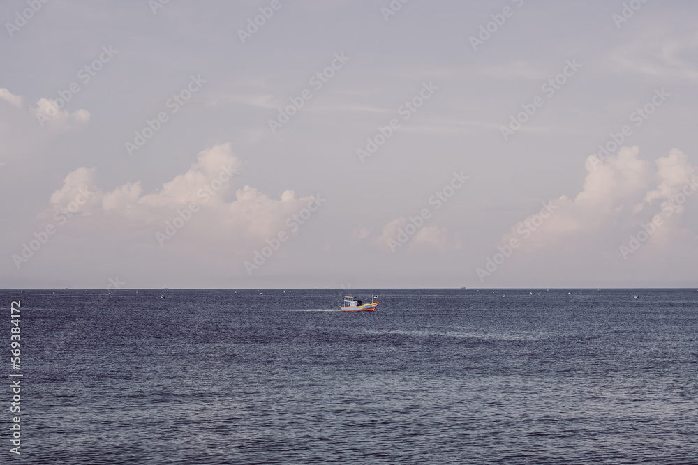 Sea sky cumulus cloud landscape view background. Calm water alone fishing boat. Destination aim progress concept