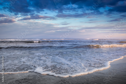 Secluded beach in Torres at dramatic evening, Rio Grande do Sul, Brazil