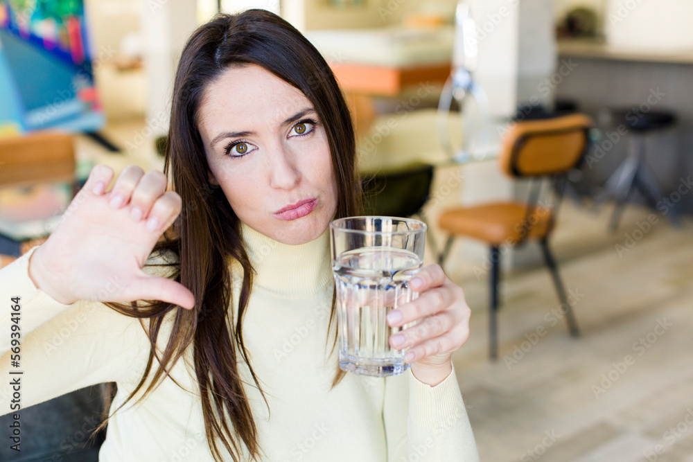 young adult woman with a water glass young adult woman with a water glass