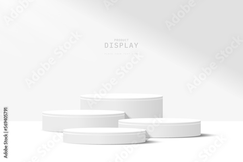 Abstract white 3D room with set of realistic gray and white cylinder pedestal podium. Minimal scene for product display presentation. Geometric forms design. Round stage for show product.