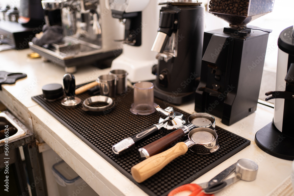 Banner of Asian Barista tamping the portafilter and preparing cup of coffee