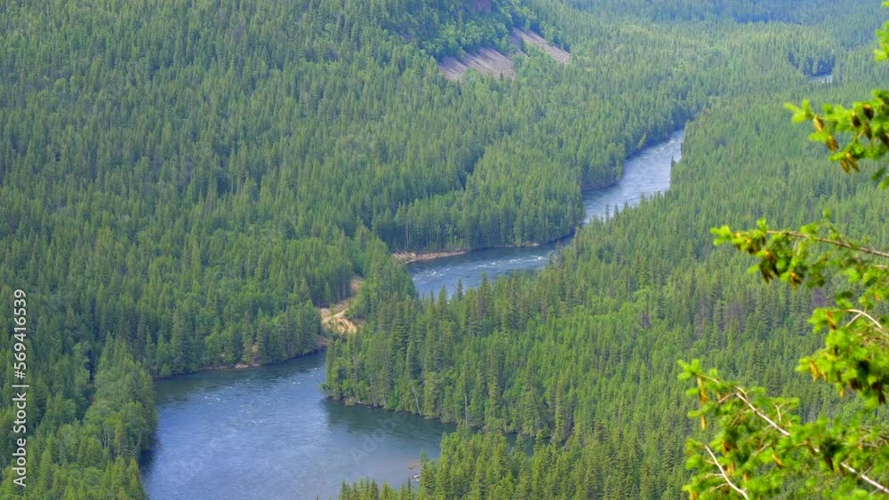 Establishing shot of majestic mountain river with mountain background in Vancouver, Canada, North America. Day time on April 2022. Still camera view. ProRes 422 HQ. Establishing shot of majestic mountain river with mountain background in Vancouver, Canada, North America. Day time on April 2022. Still camera view. ProRes 422 HQ.