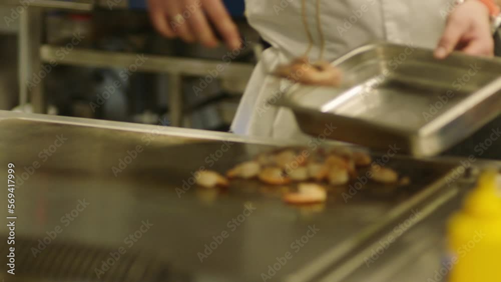 A professional chef prepares shrimp in the restaurant kitchen. Professional preparation of shrimps A professional chef prepares shrimp in the restaurant kitchen. Professional preparation of shrimps