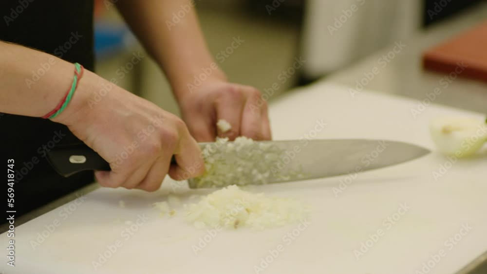 The chef cuts vegetables professionally. Professional cooking