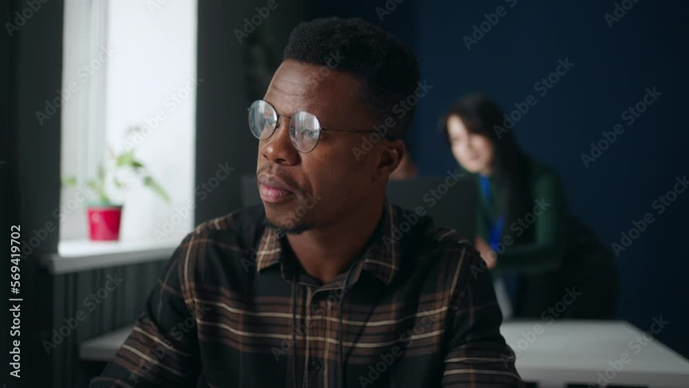 african american guy working with computer in office of software development company, portrait african american guy working with computer in office of software development company, portrait