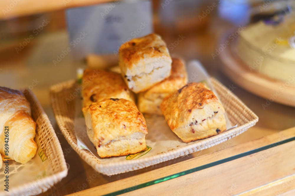 scones on wooden plate, scones for dessert - fresh homemade butter scones in bakery cake shop