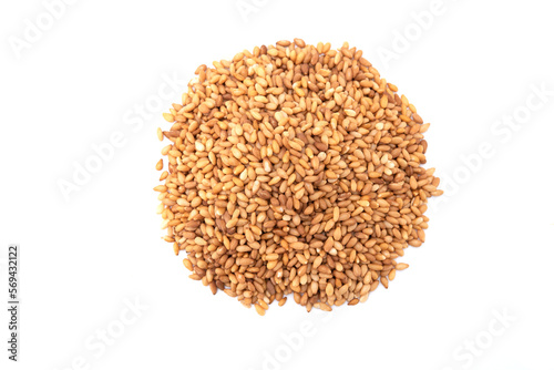 Top view of golden sesame seeds isolated on white background