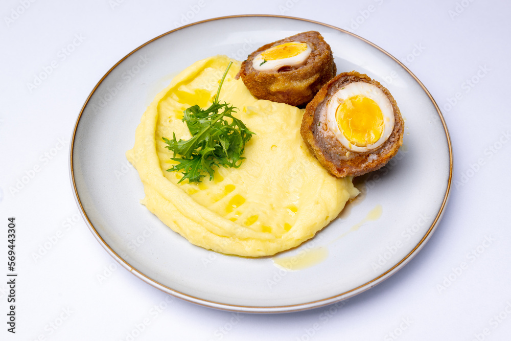 Minced meat with egg with mashed potatoes, scotch egg Minced meat with egg with mashed potatoes, scotch egg