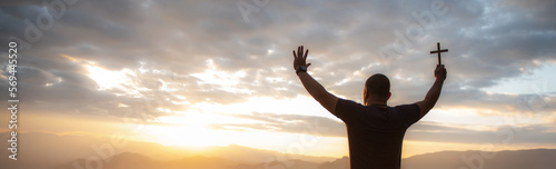 The human hand raises his palm open to worship. Eucharist, bless the Lord, help Catholics repent of Easter. behind the concept of Christianity Battle and Victory for God