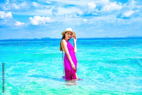 woman with a pink dress on the beach in krabi thailand, chicken island, tup island, photo shooting, model shooting 