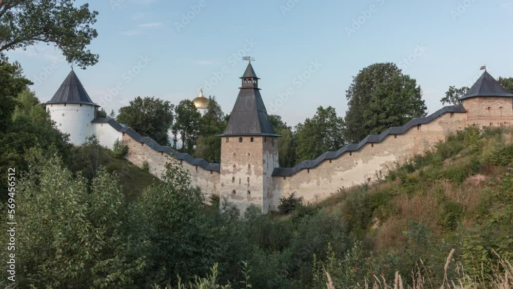 View of the wall and towers of The Holy Dormition Pskovo-Pechersky Monastery. Russia. Time-lapse. View of the wall and towers of The Holy Dormition Pskovo-Pechersky Monastery. Russia. Time-lapse.