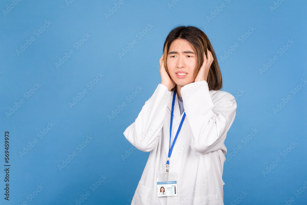 Portrait of an asian doctor distressed gesturising fear Portrait of an asian doctor distressed gesturising fear