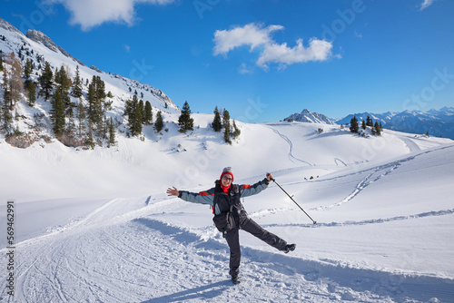middle-aged woman has fun winter hiking in rofan photo