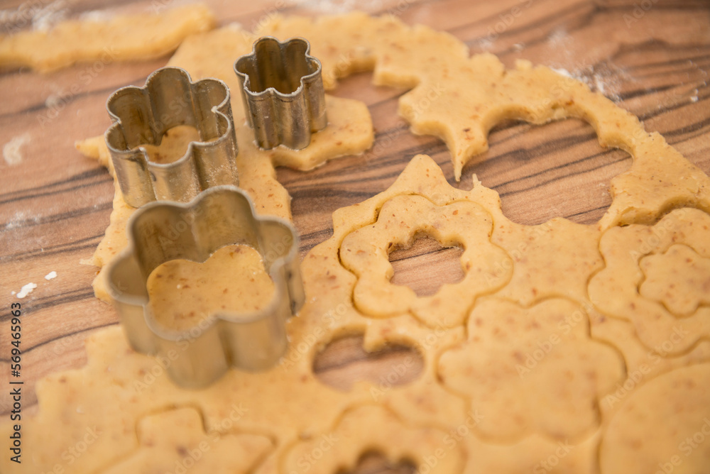 Dough rolled out and various shape cookies cut out with different cutters, Munich, Bavaria, Germany Dough rolled out and various shape cookies cut out with different cutters, Munich, Bavaria, Germany