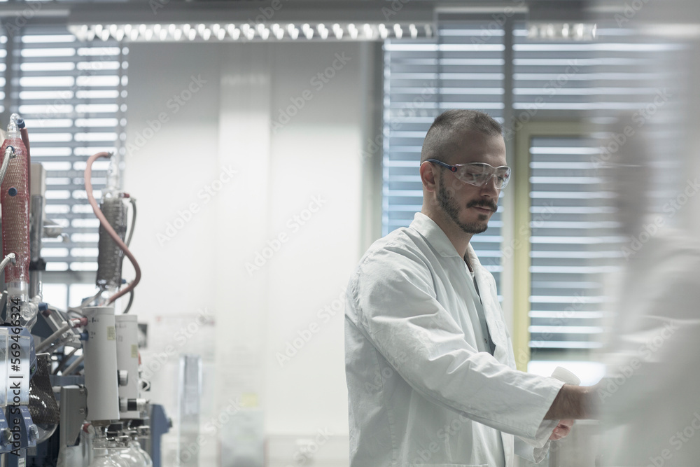 Young scientist working in a pharmacy lab, Freiburg im Breisgau, Baden-Württemberg, Germany Young scientist working in a pharmacy lab, Freiburg im Breisgau, Baden-Württemberg, Germany