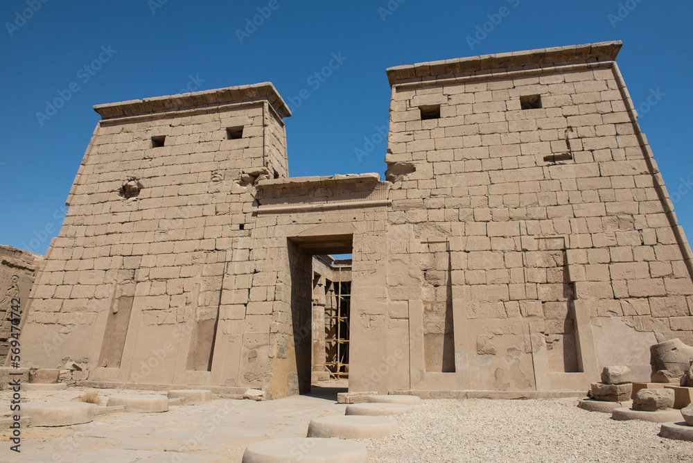 Ancient egyptian temple entrance wall with hieroglyphics