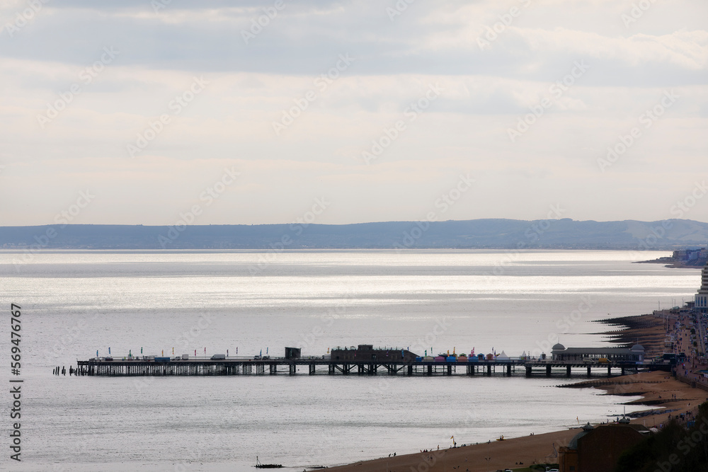 Evening, with the Beach and the Famous Pier in Hastings, England Evening, with the Beach and the Famous Pier in Hastings, England