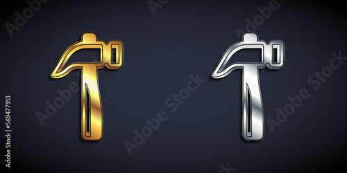 Gold and silver Hammer icon isolated on black background. Tool for repair. Long shadow style. Vector