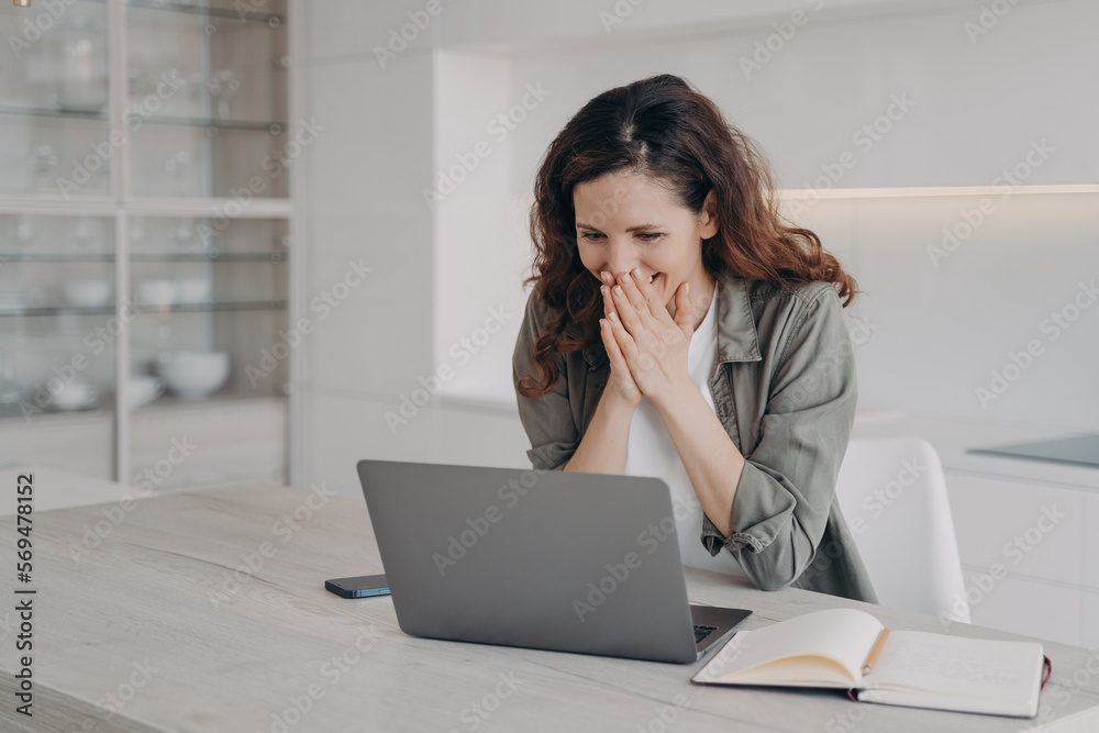 Excited young businesswoman has video call on laptop. Corporate internet session. Excited young businesswoman has video call on laptop. Corporate internet session.
