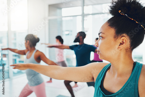 Yoga, exercise class and fitness people in warrior or stretching for health and wellness. Diversity men and women group together for workout, training or pilates for healthy lifestyle motivation